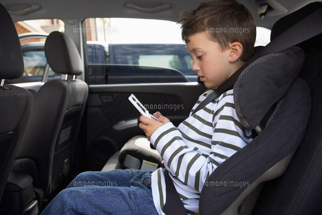 Boy Playing Hand Held Game
(c)Radius Images