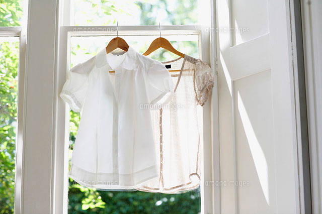 Two blouses on Hangers in domestic window
(c)moodboard