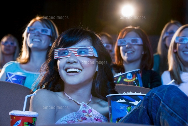 People wearing 3-d glasses watching 3-D movie in theatre
(c)moodboard