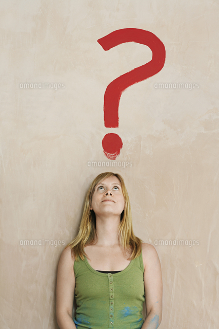 Woman leaning against wall with painted question mark
(c)moodboard