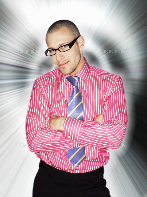 Business man in glasses smiling in front of light effect
(c)moodboard