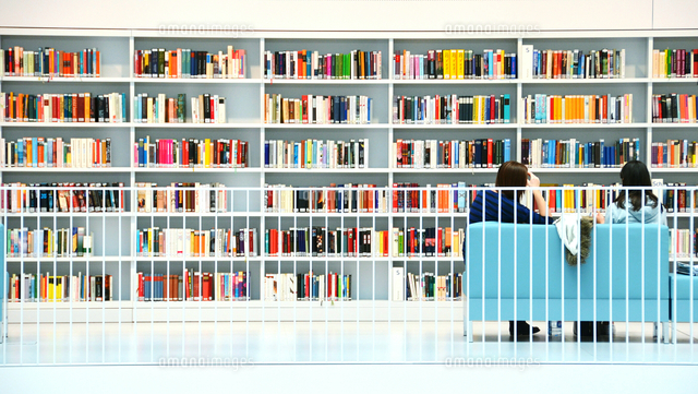 Rear View Of People Sitting On Sofa In Front Of Book Selves At Library
(c)Joerg Fockenberg / EyeEm